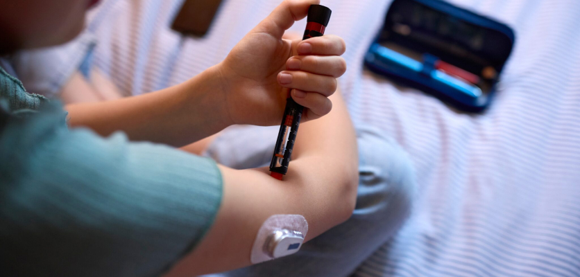 Person injecting insulin into the arm, showing insulin therapy for Type 3c diabetes